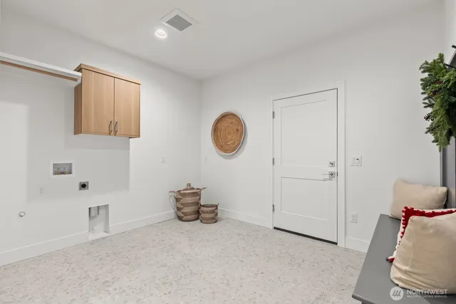 a hallway with a couch and chandelier