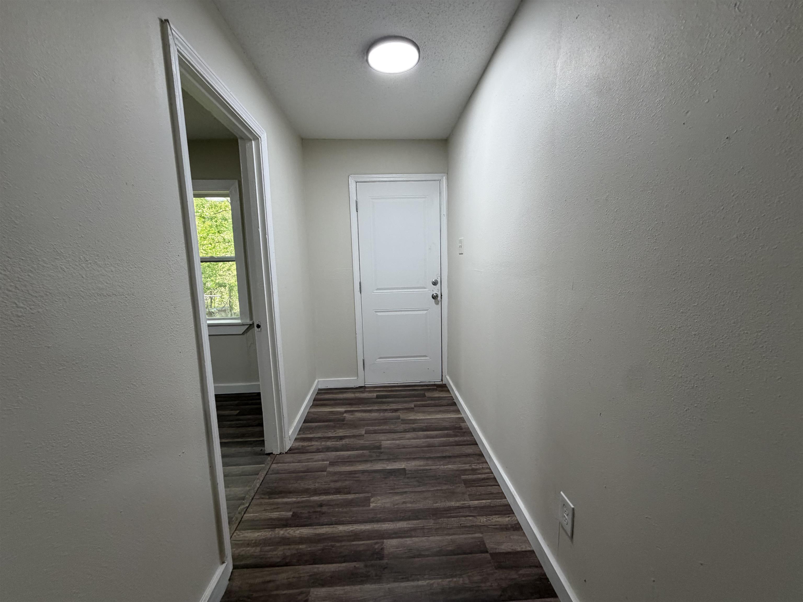 8 East Brooks Road Memphis, TN 38109 - Photo 15 of 16 a view of a hallway with wooden floor and staircase