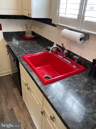 a kitchen with stainless steel appliances granite countertop a stove and a refrigerator