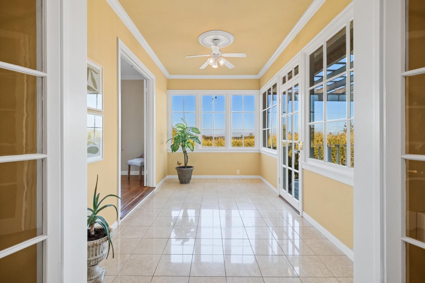 681 Upland Road Redwood City, CA 94062 - Photo 14 of 85 a view of an entryway with wooden floor and a potted plant