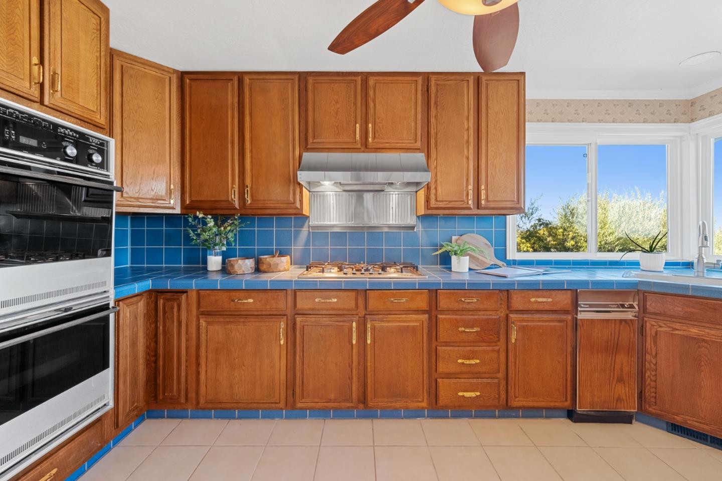 681 Upland Road Redwood City, CA 94062 - Photo 24 of 85 a kitchen with a sink cabinets and appliances
