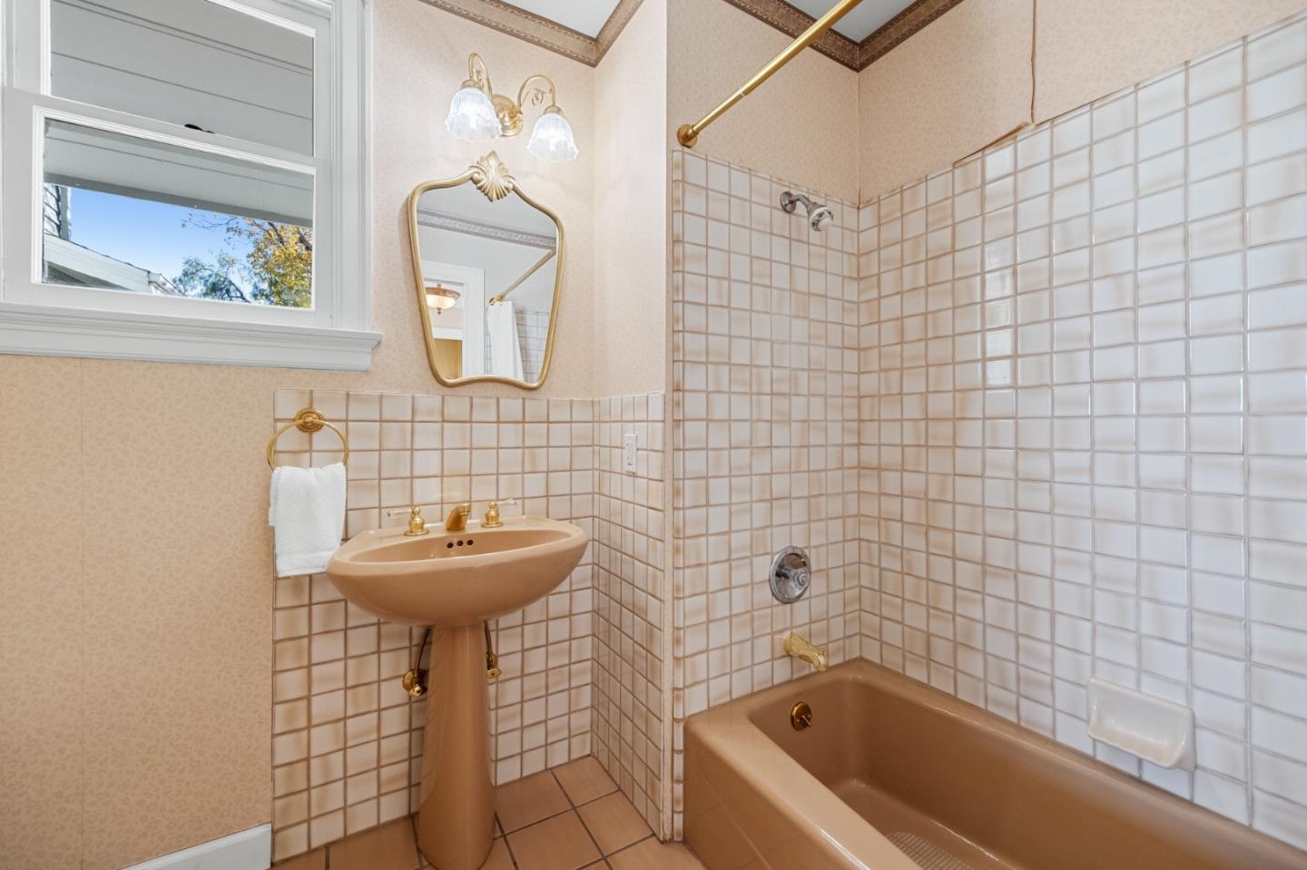 681 Upland Road Redwood City, CA 94062 - Photo 49 of 85 a bathroom with a sink a bathtub and shower