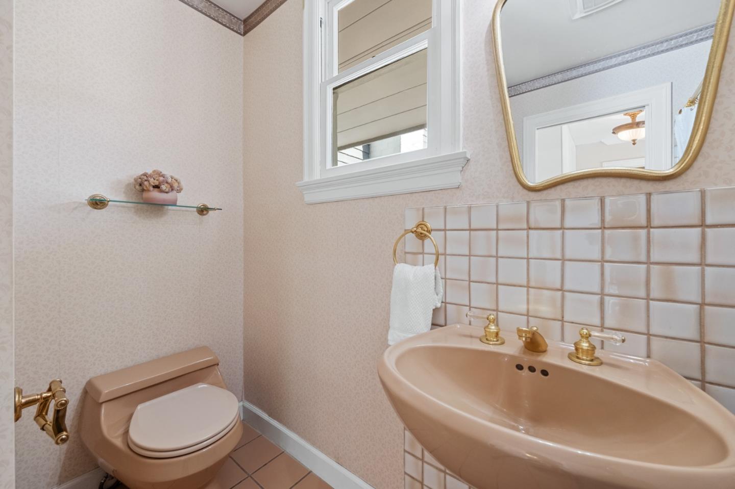 681 Upland Road Redwood City, CA 94062 - Photo 50 of 85 a bathroom with a toilet sink and mirror