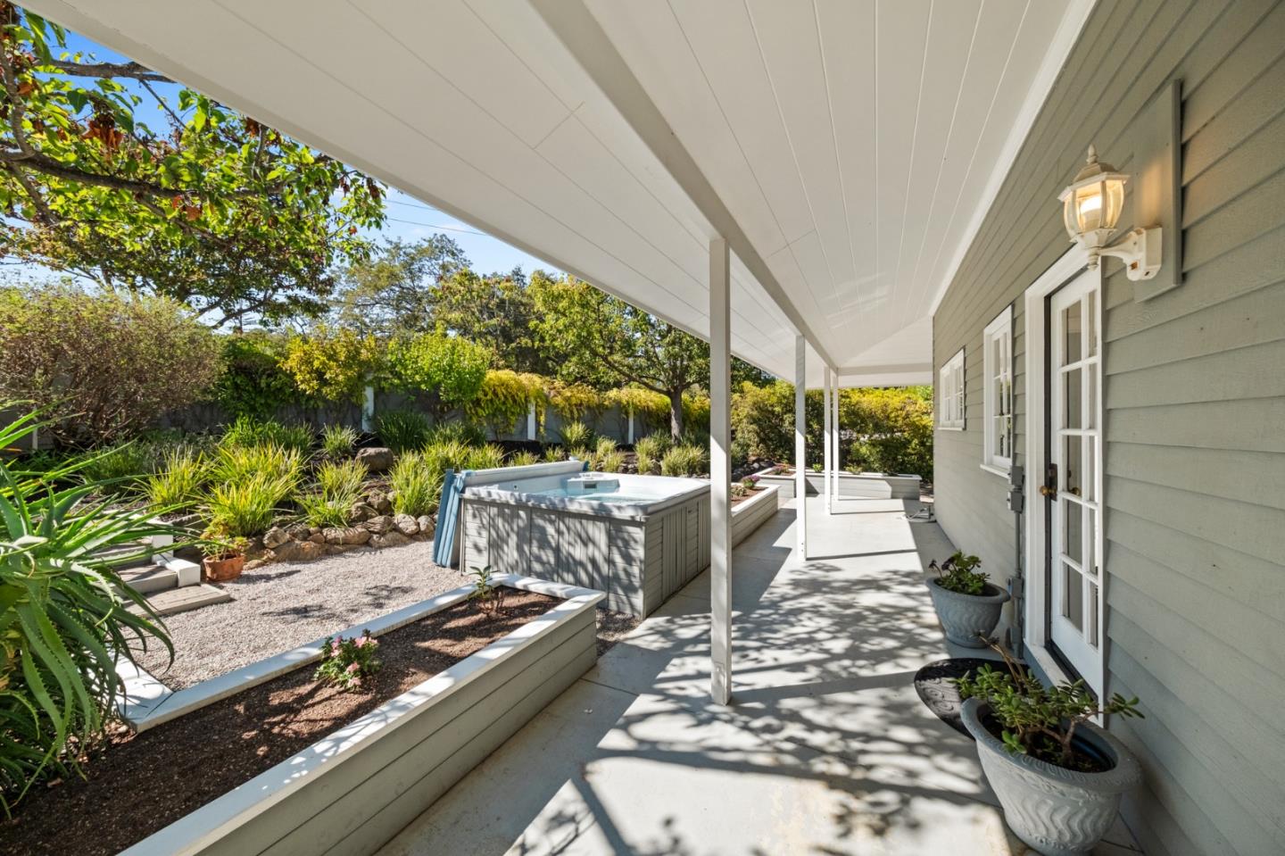 681 Upland Road Redwood City, CA 94062 - Photo 63 of 85 a view of a patio with table and chairs potted plants with wooden floor