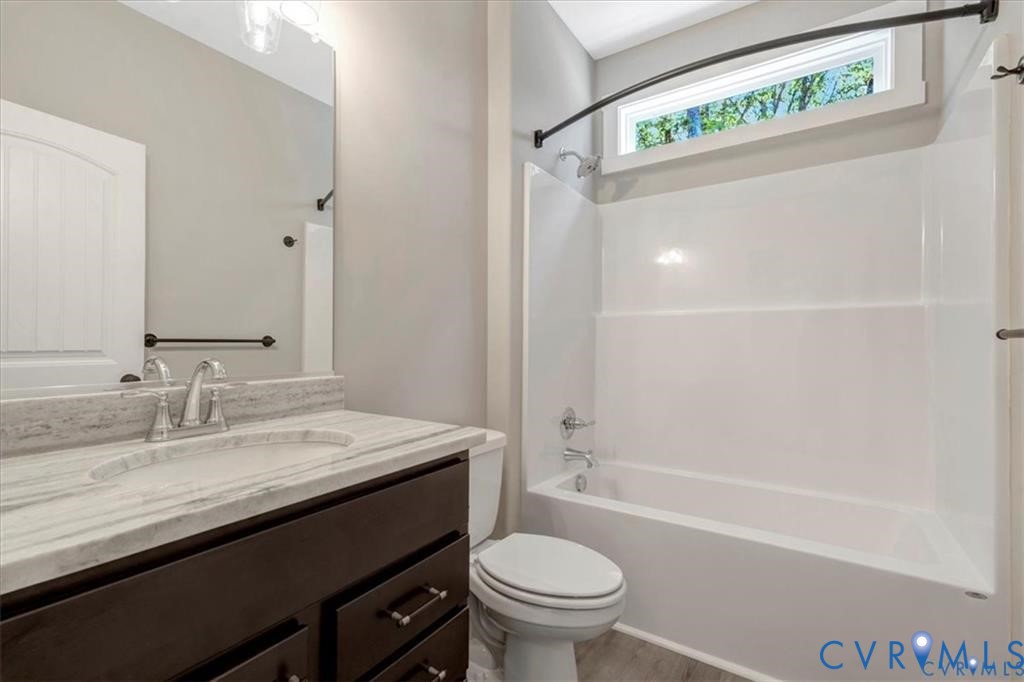 227 Oak Run Clarksville, VA 23927 - Photo 9 of 12 a bathroom with a sink a toilet and shower