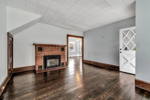 a view of room with hardwood floor and window