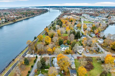 an aerial view of residential houses with outdoor space