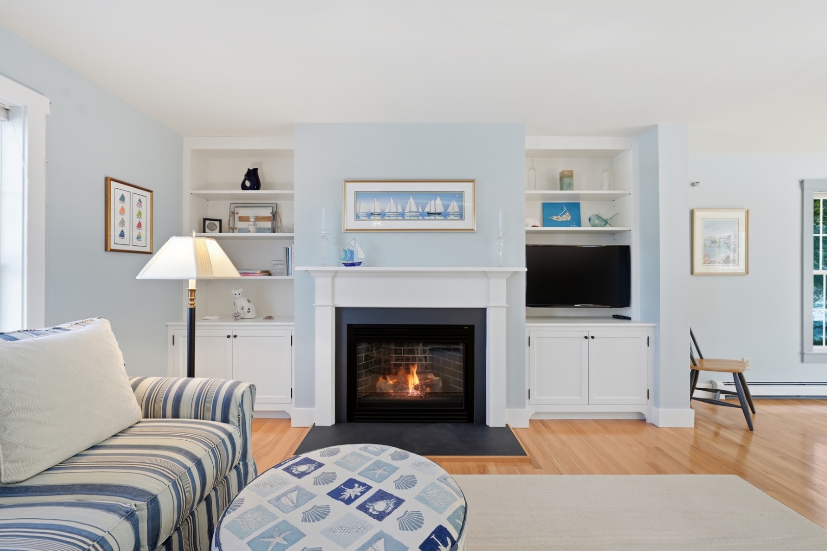 20 Rudder Lane Nantucket, MA 02554 - Photo 5 of 34 a living room with furniture a flat screen tv and a fireplace