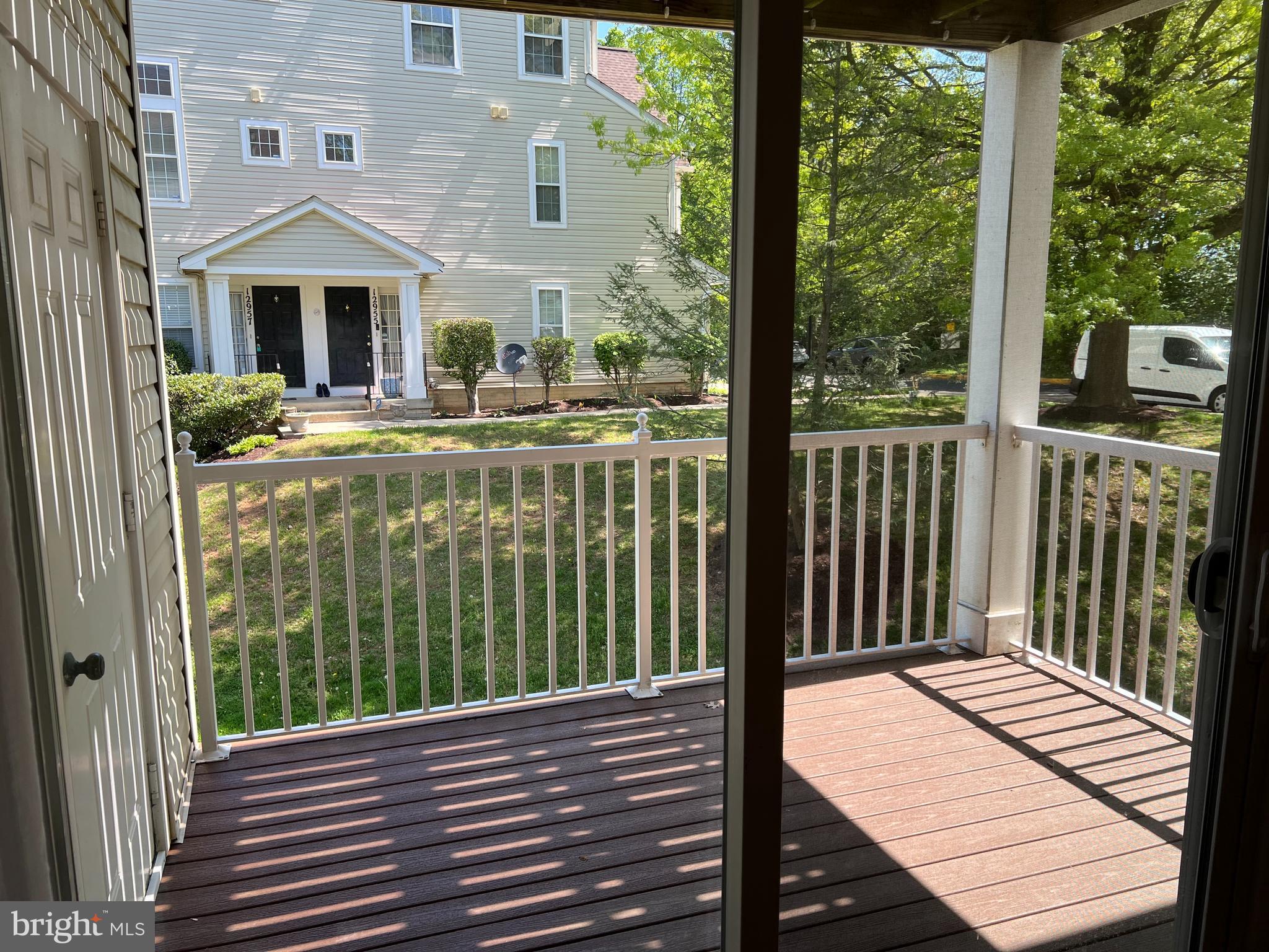 13001 Bridger Drive, Unit 1514 Germantown, MD 20874 - Photo 12 of 15 a view of a house with wooden floor next to a yard