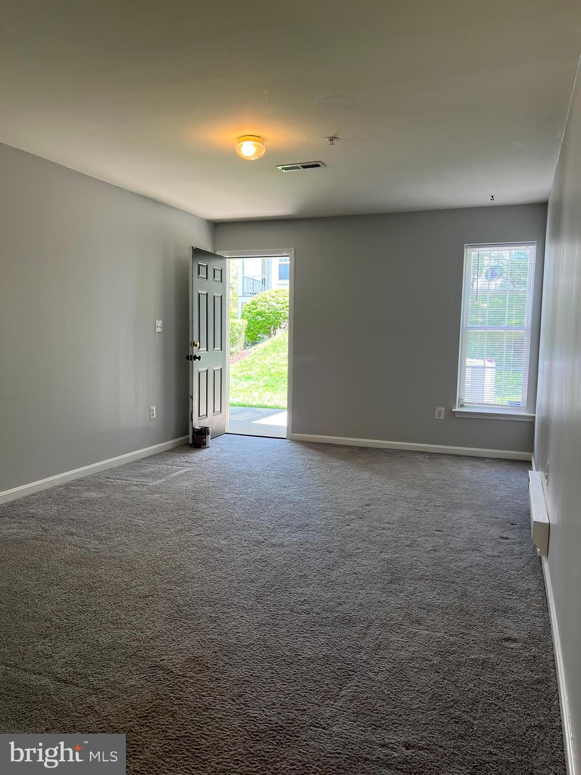 13001 Bridger Drive, Unit 1514 Germantown, MD 20874 - Photo 8 of 15 a view of an empty room with a window