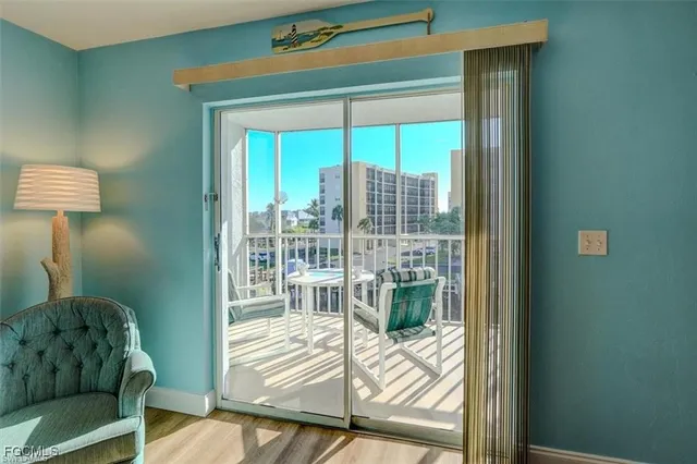 a view of a livingroom with furniture and front door