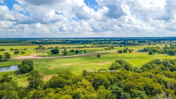 a view of a swimming pool with a yard