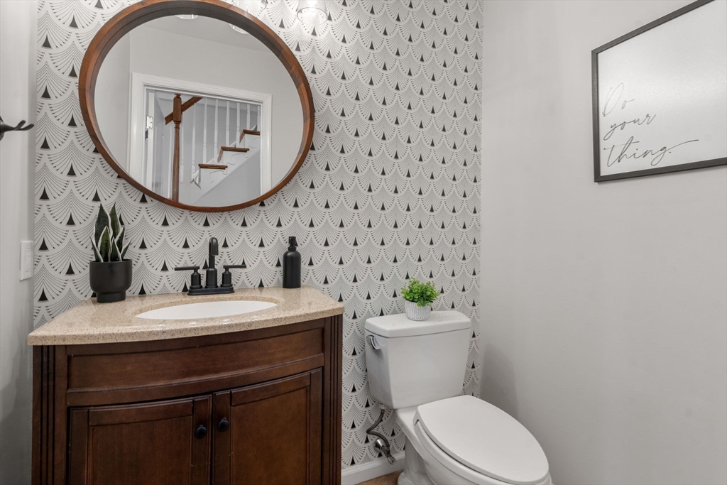 11 Iron Hollow Road Sharon, MA 02067 - Photo 14 of 42 a bathroom with a sink a toilet and a mirror