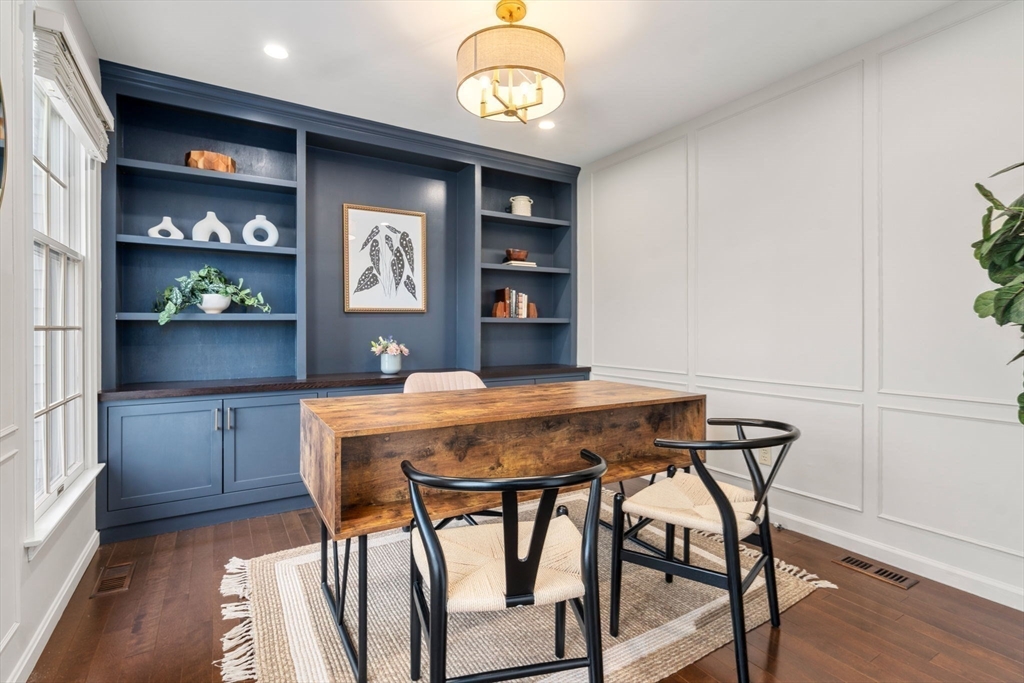 11 Iron Hollow Road Sharon, MA 02067 - Photo 17 of 42 a dining room with a table and chairs