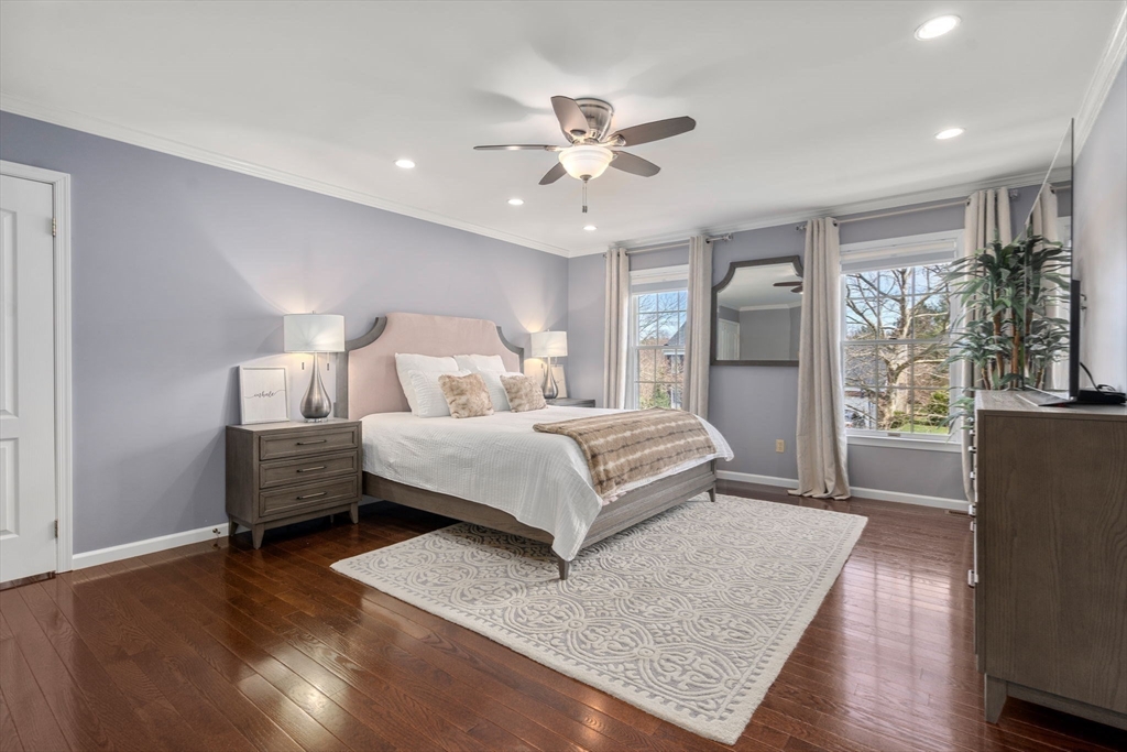 11 Iron Hollow Road Sharon, MA 02067 - Photo 18 of 42 a bedroom with a large bed and wooden floor