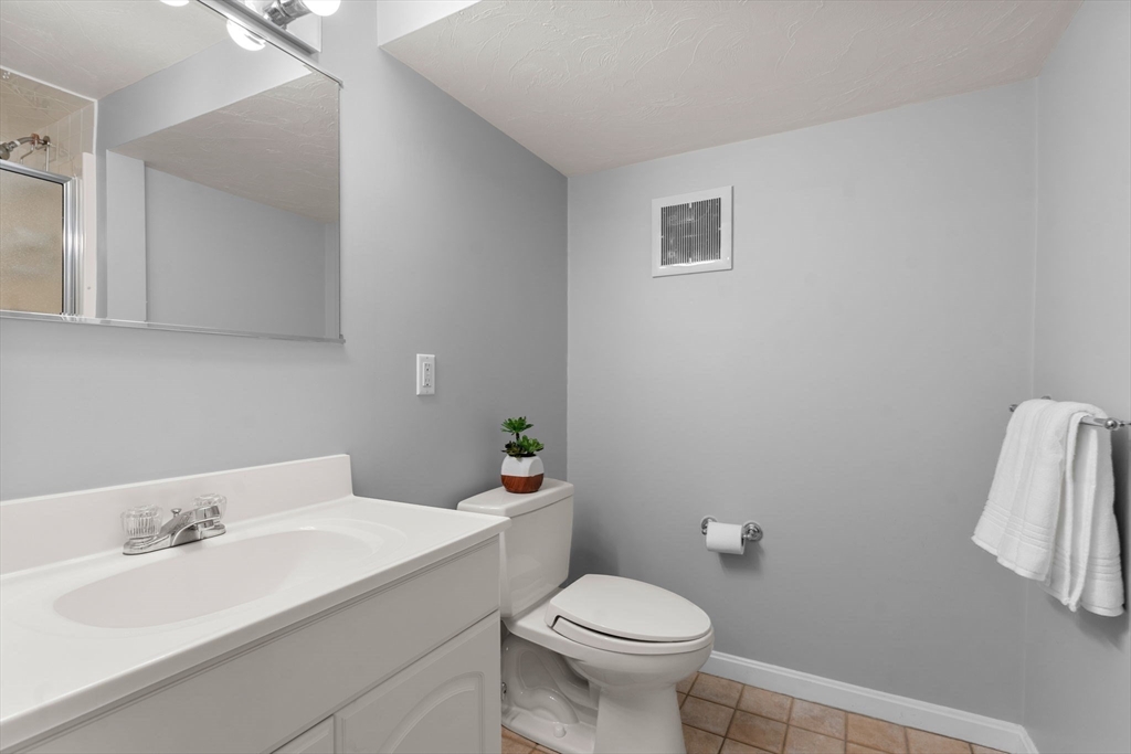 11 Iron Hollow Road Sharon, MA 02067 - Photo 30 of 42 a bathroom with a sink toilet and vanity