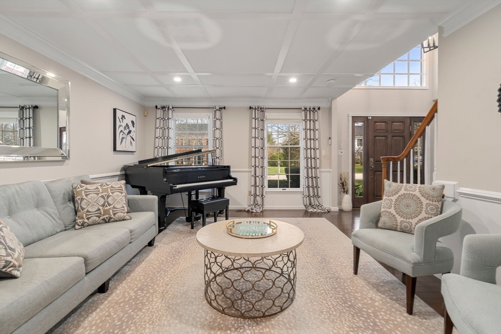 11 Iron Hollow Road Sharon, MA 02067 - Photo 3 of 42 a living room with furniture and a table