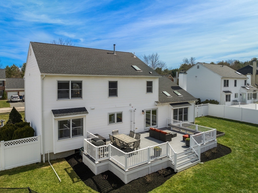 11 Iron Hollow Road Sharon, MA 02067 - Photo 36 of 42 a view of a house with couches chairs and city view