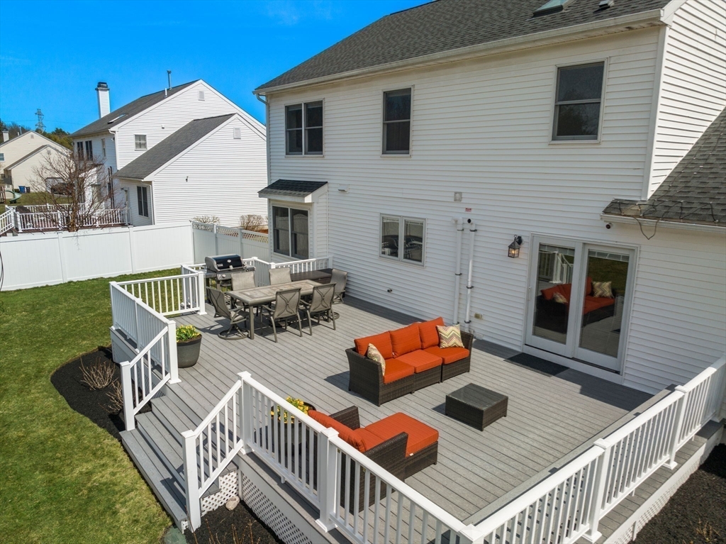 11 Iron Hollow Road Sharon, MA 02067 - Photo 38 of 42 a view of a patio with couches chairs and wooden floor