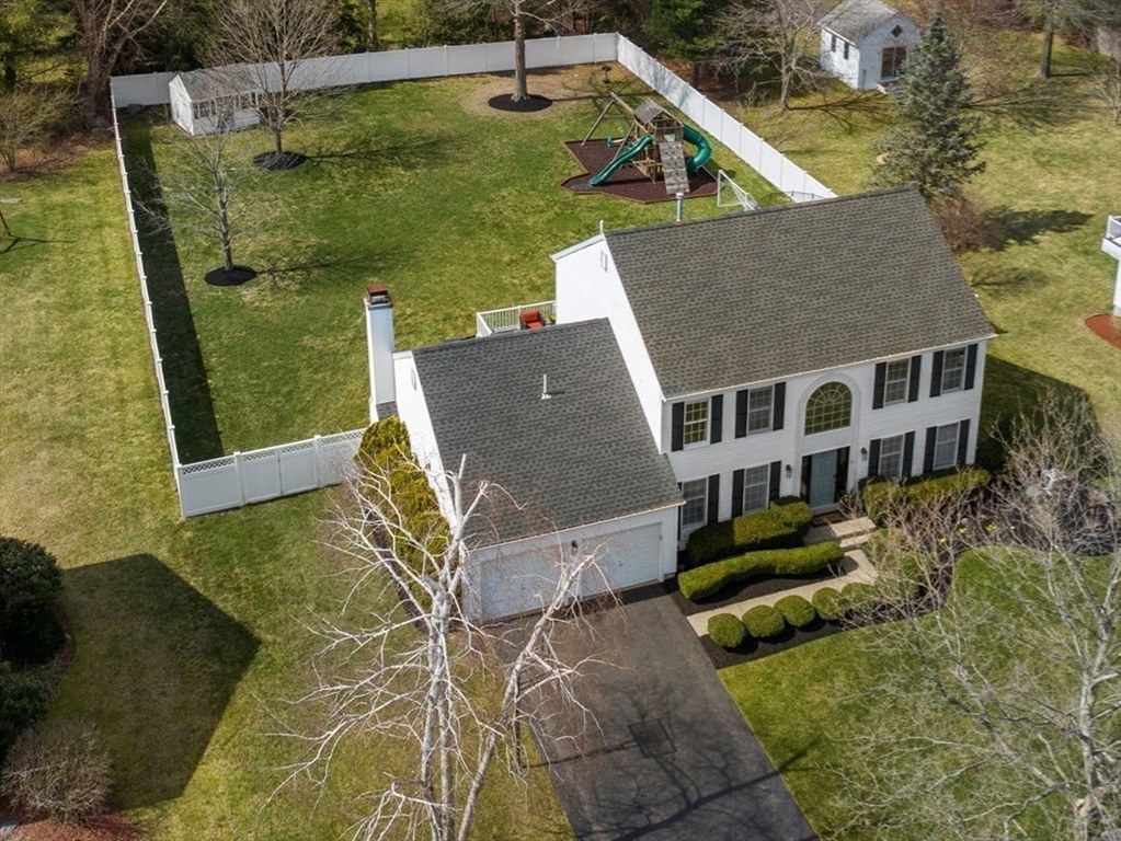 11 Iron Hollow Road Sharon, MA 02067 - Photo 40 of 42 a aerial view of a house with a yard