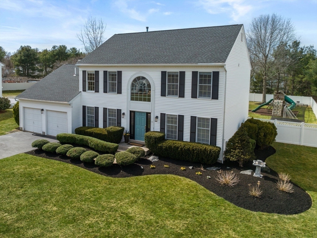 11 Iron Hollow Road Sharon, MA 02067 - Photo 41 of 42 a front view of a house with a yard