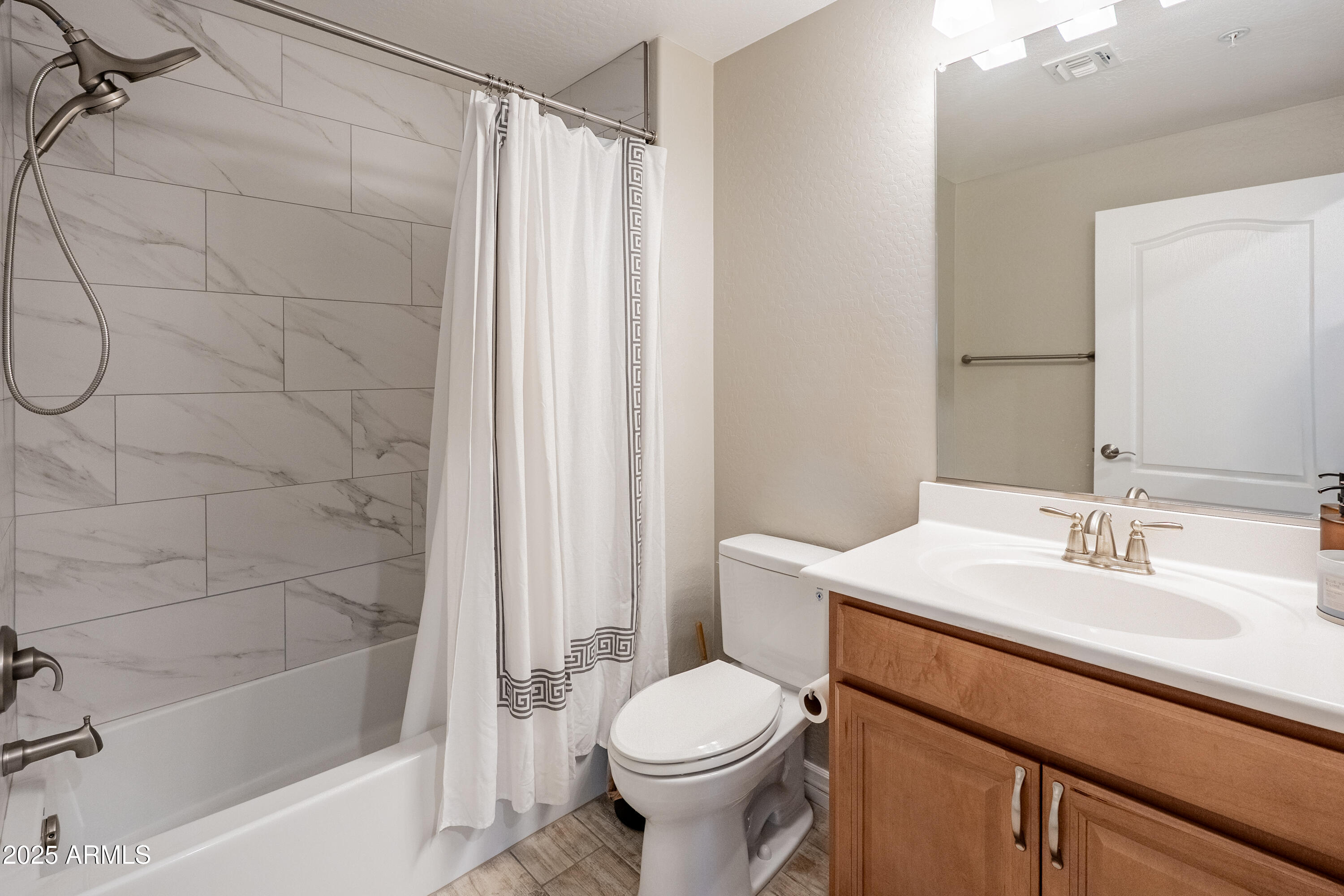 2425 West Bronco Butte Trail, Unit 1014 Phoenix, AZ 85085 - Photo 16 of 23 a bathroom with a sink toilet and shower