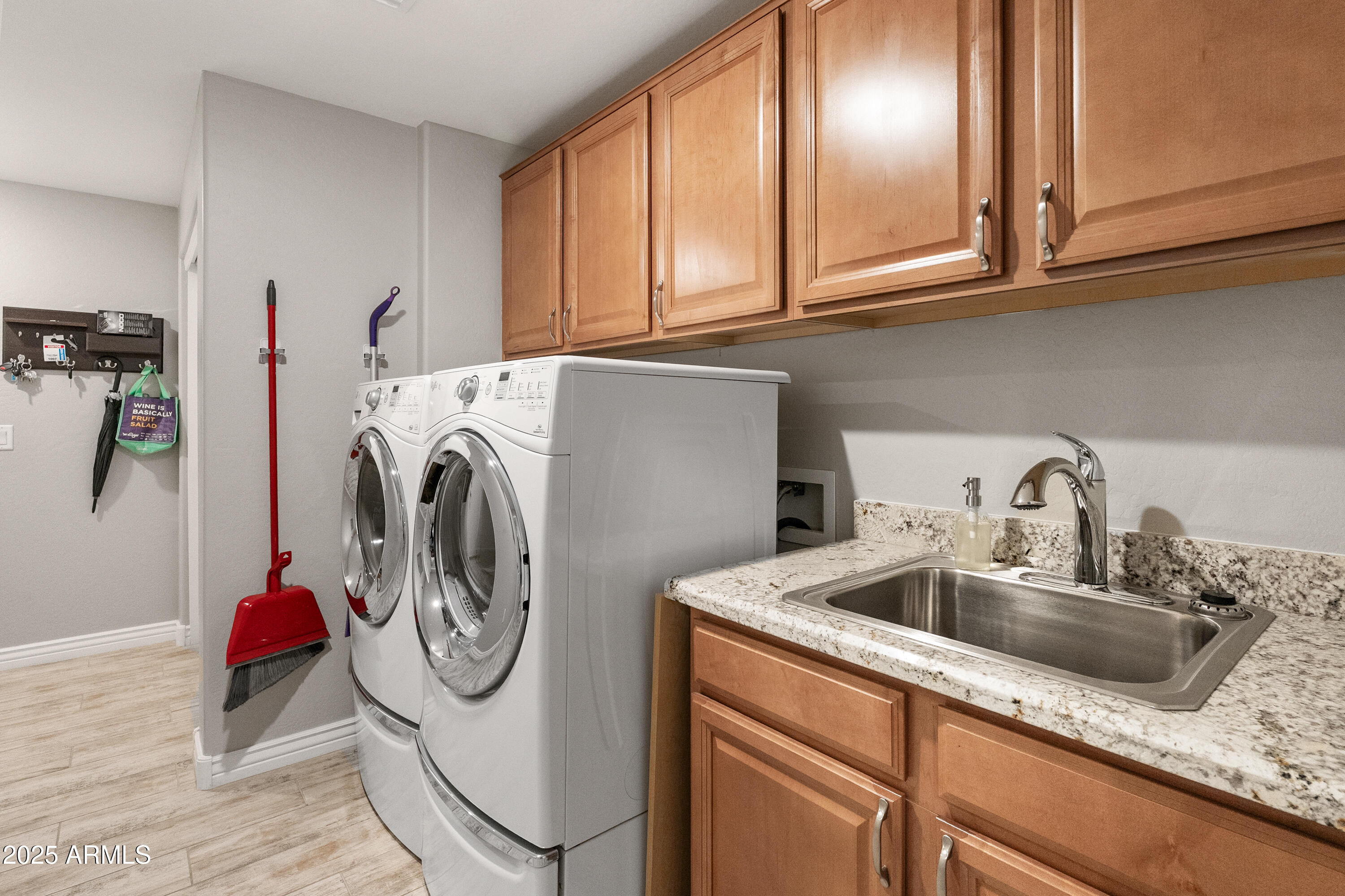 2425 West Bronco Butte Trail, Unit 1014 Phoenix, AZ 85085 - Photo 17 of 23 a utility room with multiple dryer and washer