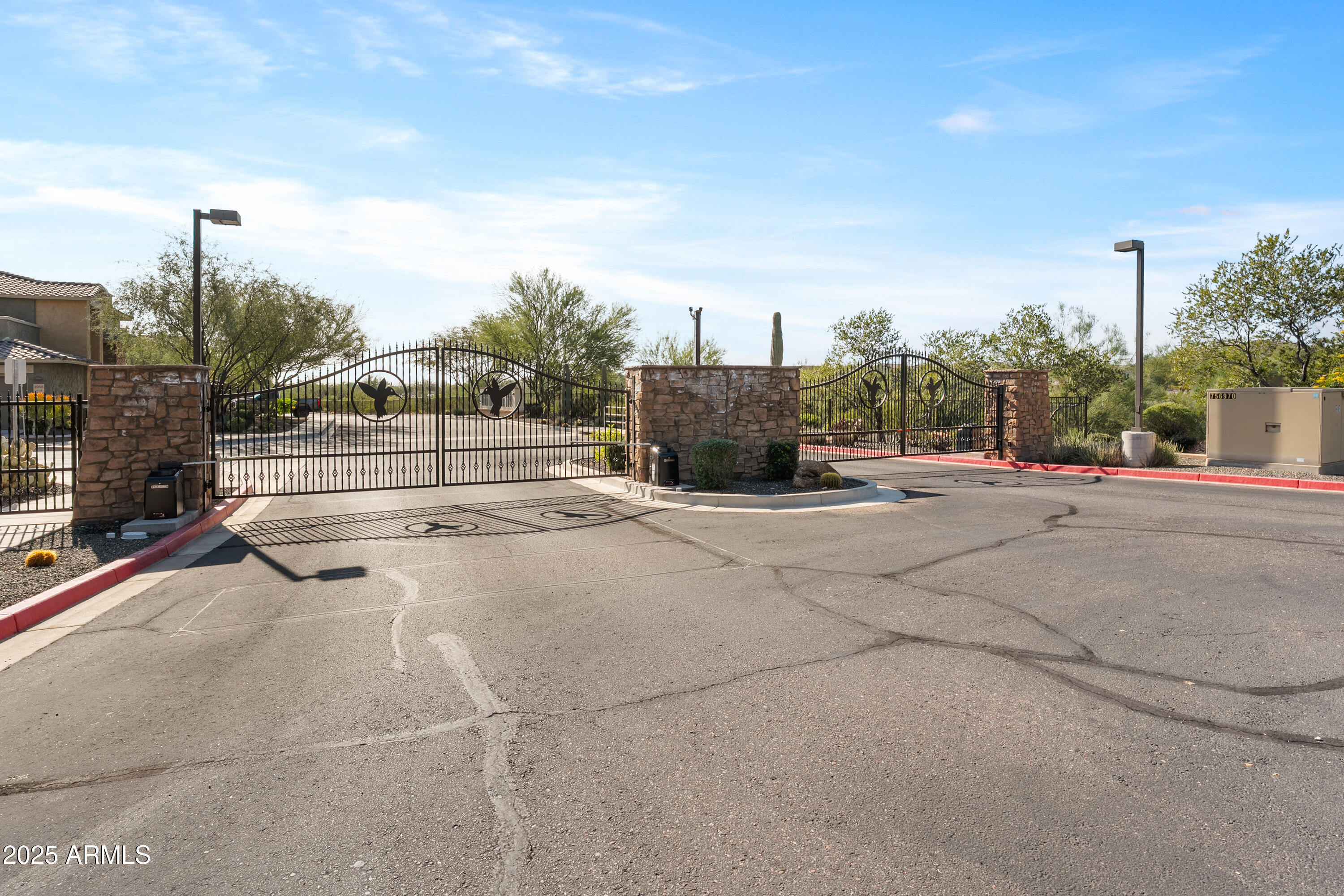 2425 West Bronco Butte Trail, Unit 1014 Phoenix, AZ 85085 - Photo 22 of 23 a view of street with cars