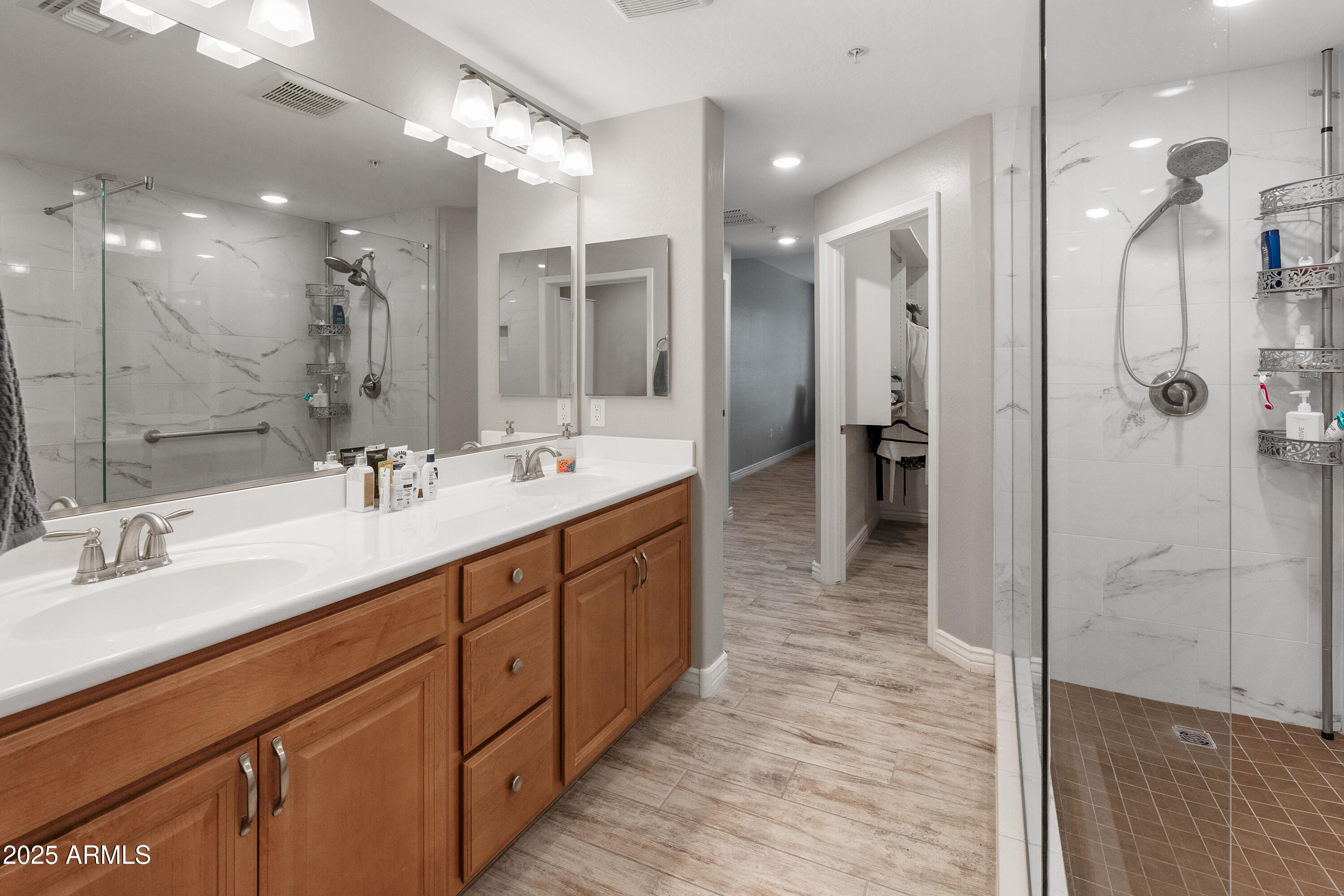 2425 West Bronco Butte Trail, Unit 1014 Phoenix, AZ 85085 - Photo 7 of 23 a bathroom with a double vanity sink mirror and shower