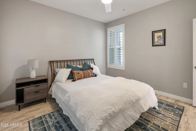 a bedroom with a bed and window