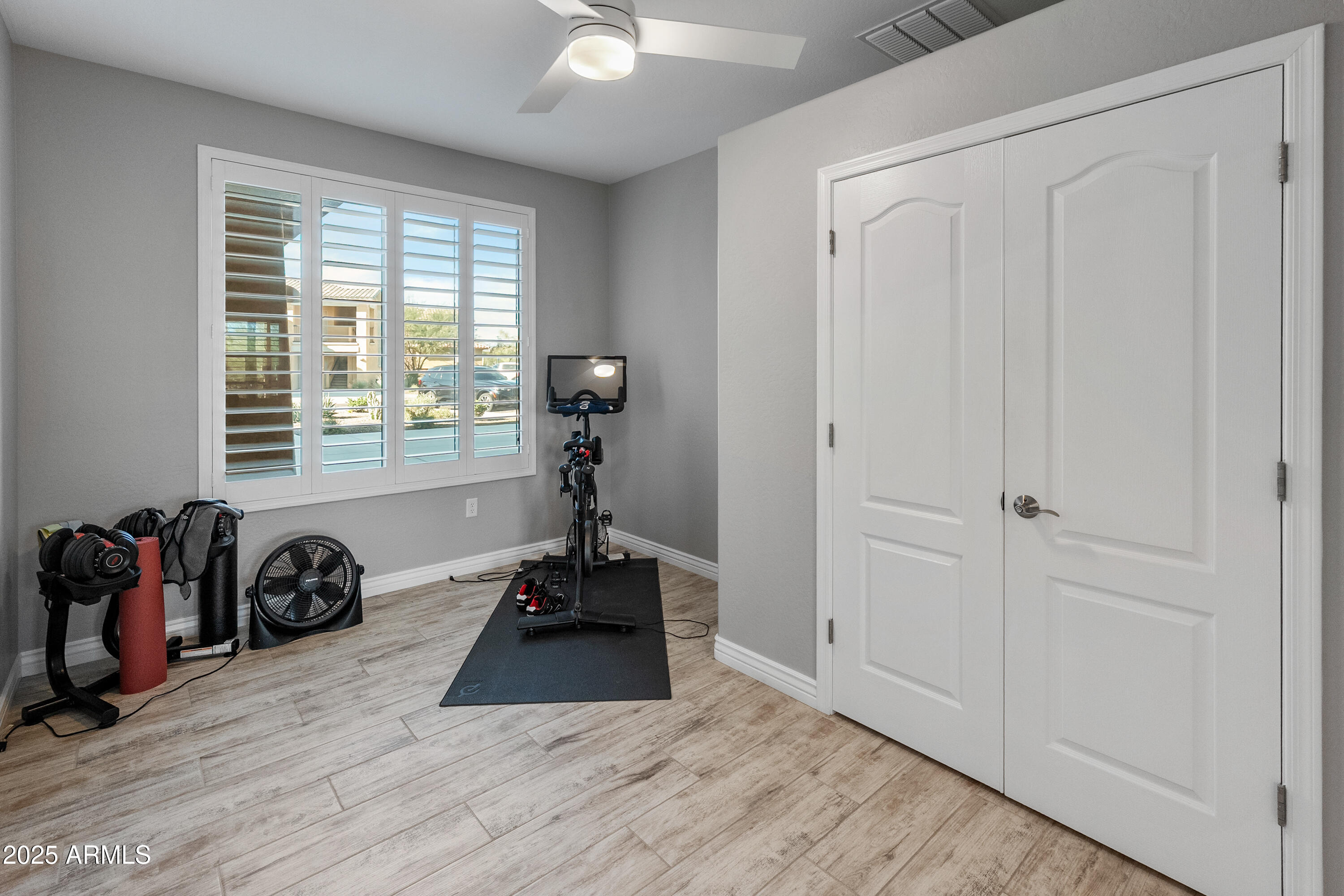 2425 West Bronco Butte Trail, Unit 1014 Phoenix, AZ 85085 - Photo 10 of 23 a view of a room with gym equipment