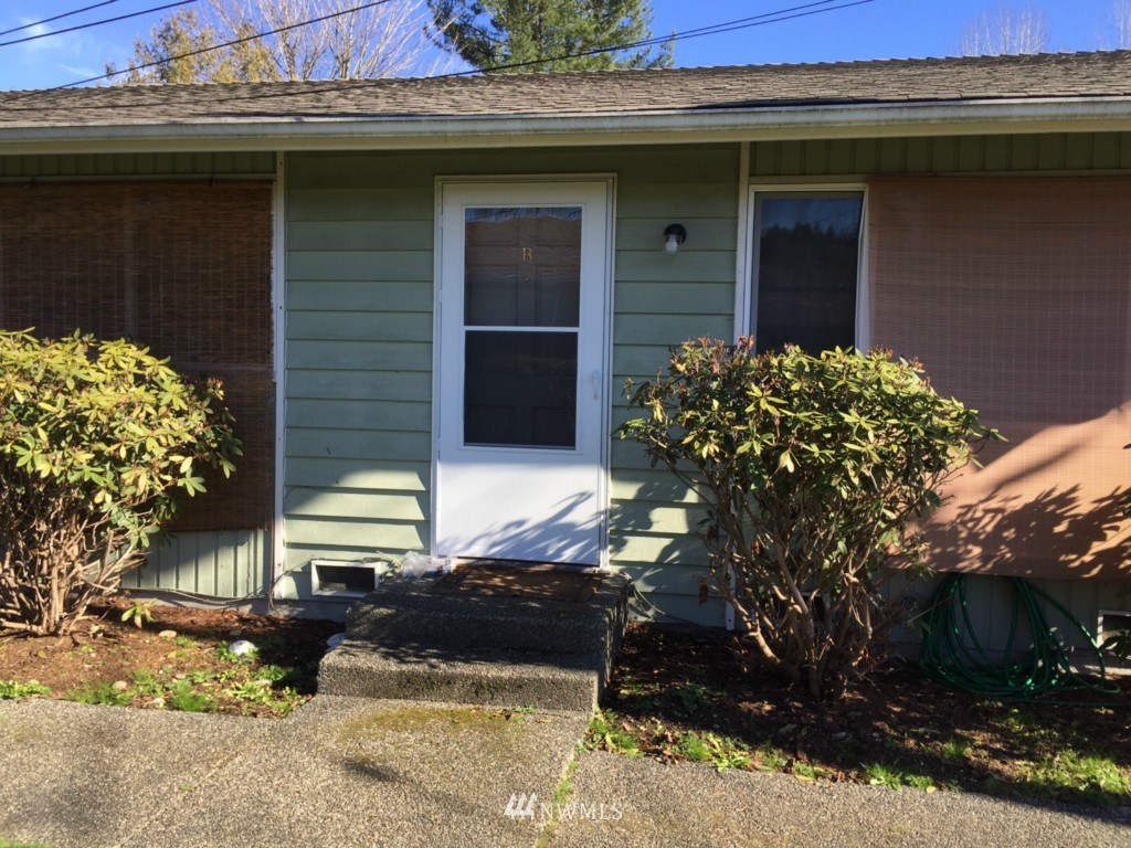24306 Carter Road Bothell, WA 98021 - Photo 3 of 17 a view of a house with a yard