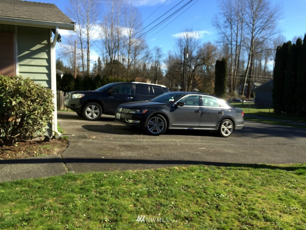 24306 Carter Road Bothell, WA 98021 - Photo 6 of 17 a view of a car parked in front of a house