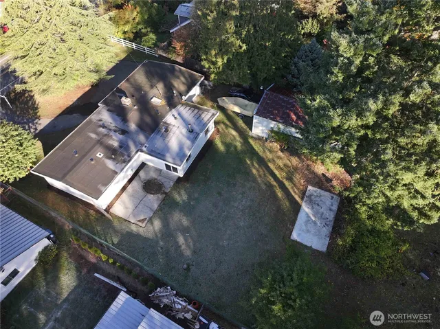 an aerial view of house with yard