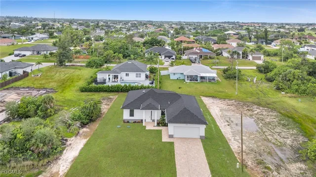an aerial view of a house with a garden