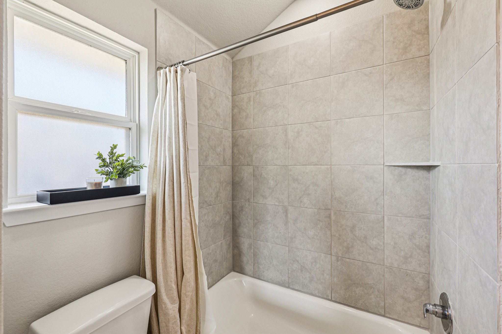 111 Insider Loop Elgin, TX 78621 - Photo 27 of 39 a bathroom with a shower and a toilet