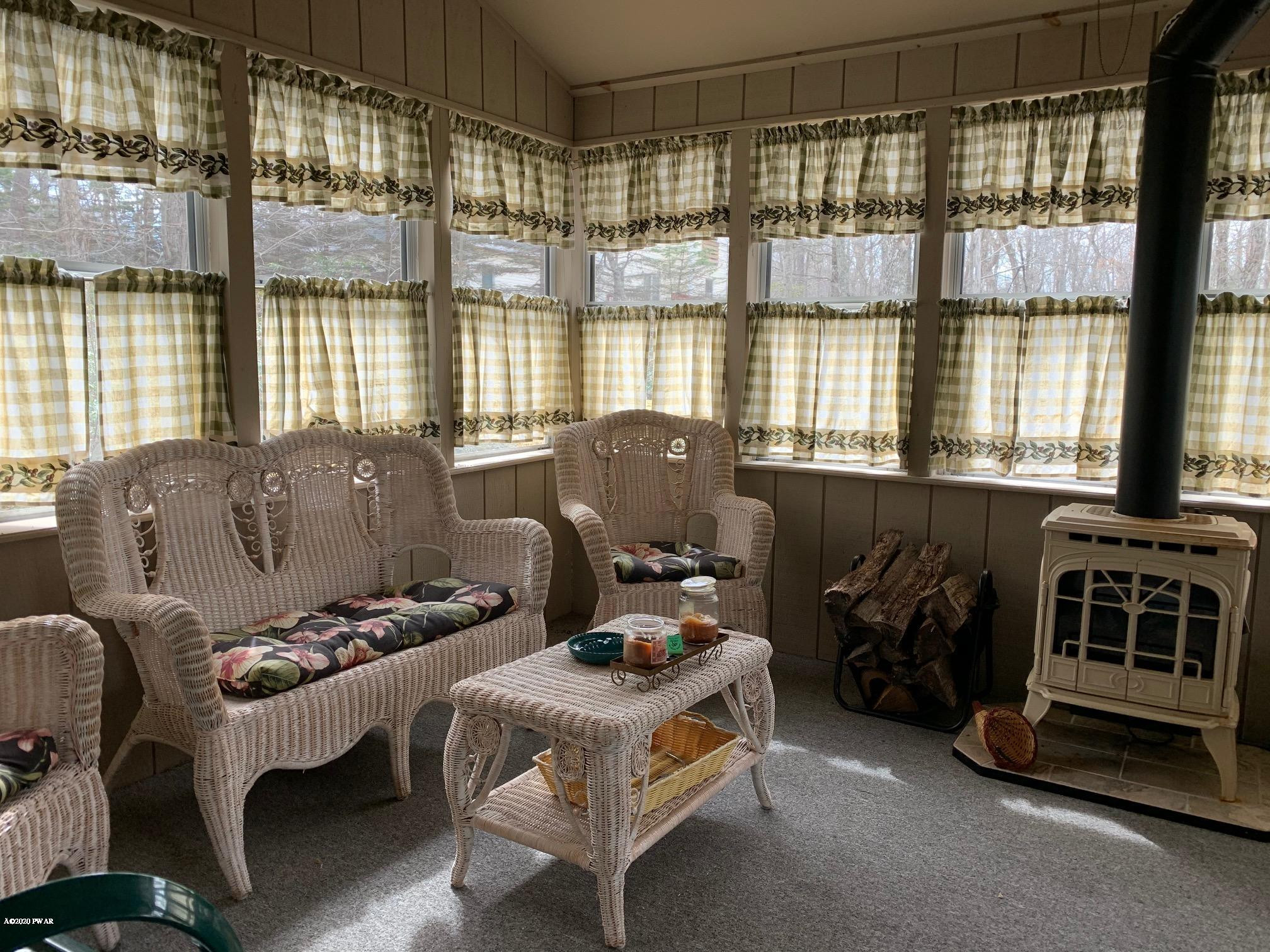 336 Maple Ridge Drive Hawley, PA 18428 - Photo 16 of 50 Sunroom Wicker sitting area