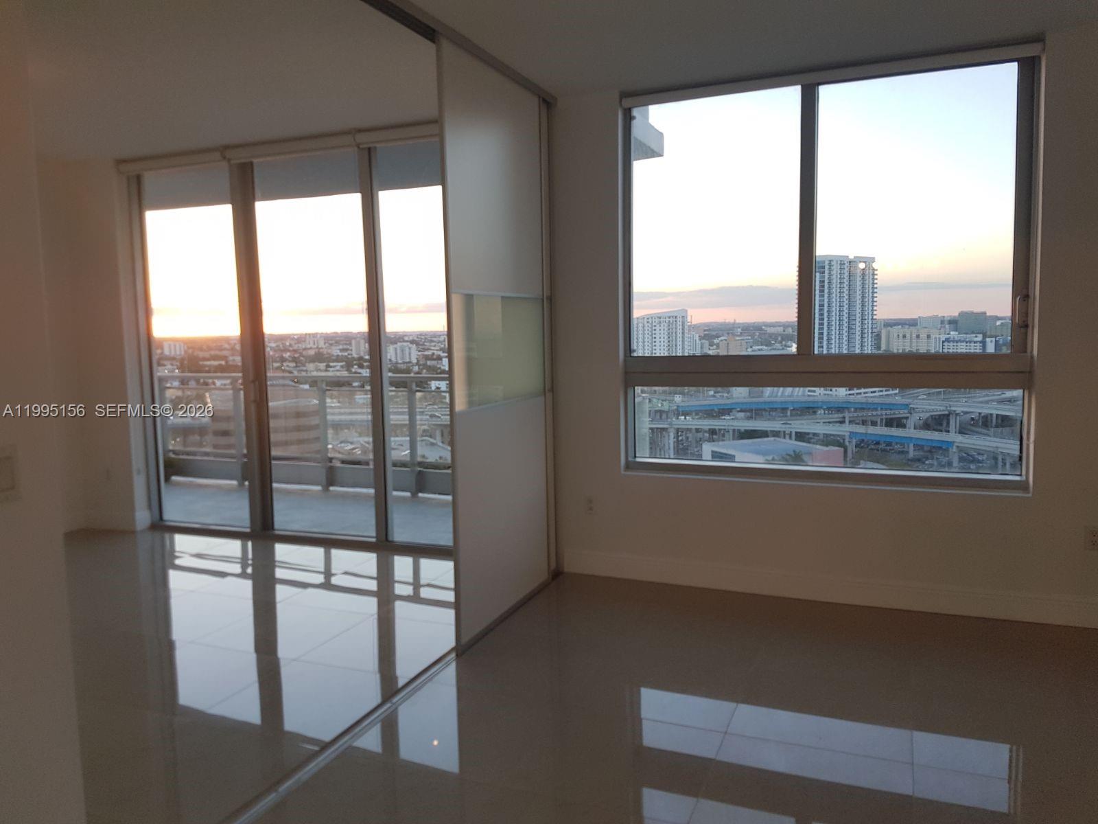 90 Southwest 3rd Street, Unit 2112 Miami, FL 33130 - Photo 13 of 40 a view of an empty room and window