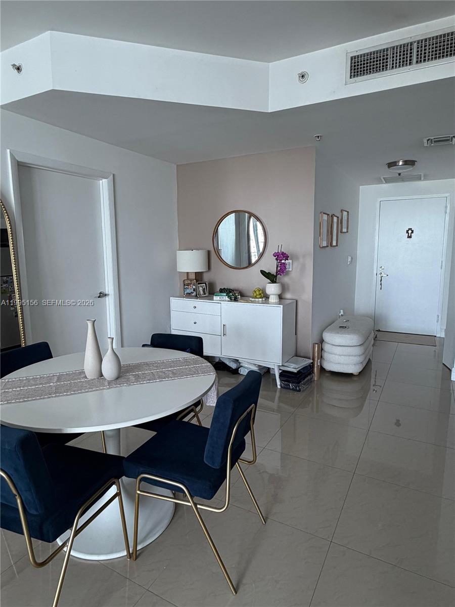 90 Southwest 3rd Street, Unit 2112 Miami, FL 33130 - Photo 14 of 40 a view of a dining room with furniture