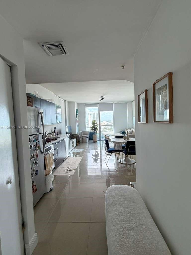 90 Southwest 3rd Street, Unit 2112 Miami, FL 33130 - Photo 19 of 40 a living room with furniture and a view of kitchen