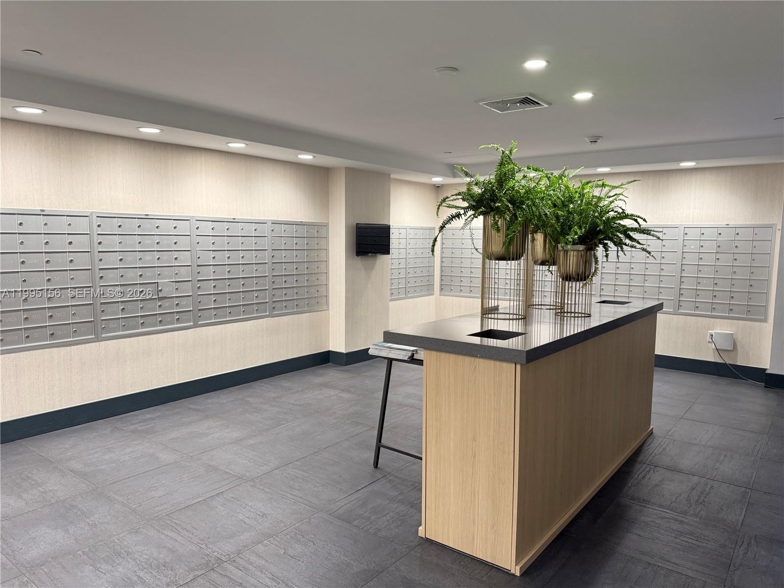 90 Southwest 3rd Street, Unit 2112 Miami, FL 33130 - Photo 25 of 40 a table with a potted plant on a counter