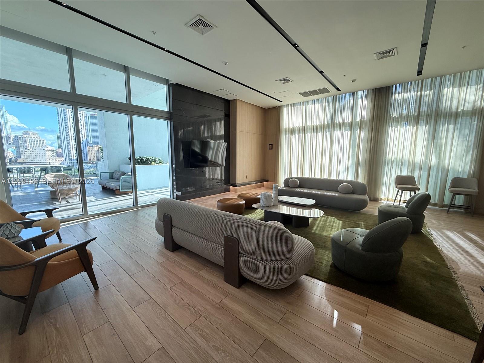 90 Southwest 3rd Street, Unit 2112 Miami, FL 33130 - Photo 29 of 40 a living room with furniture and a large window