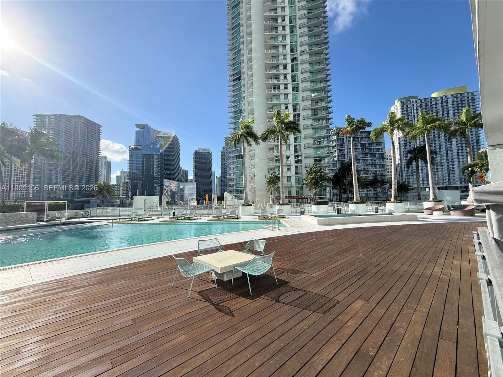 90 Southwest 3rd Street, Unit 2112 Miami, FL 33130 - Photo 30 of 40 a swimming pool with outdoor seating and yard