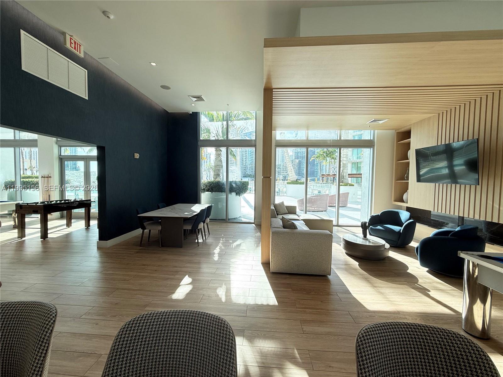 90 Southwest 3rd Street, Unit 2112 Miami, FL 33130 - Photo 34 of 40 a living room with furniture and large windows