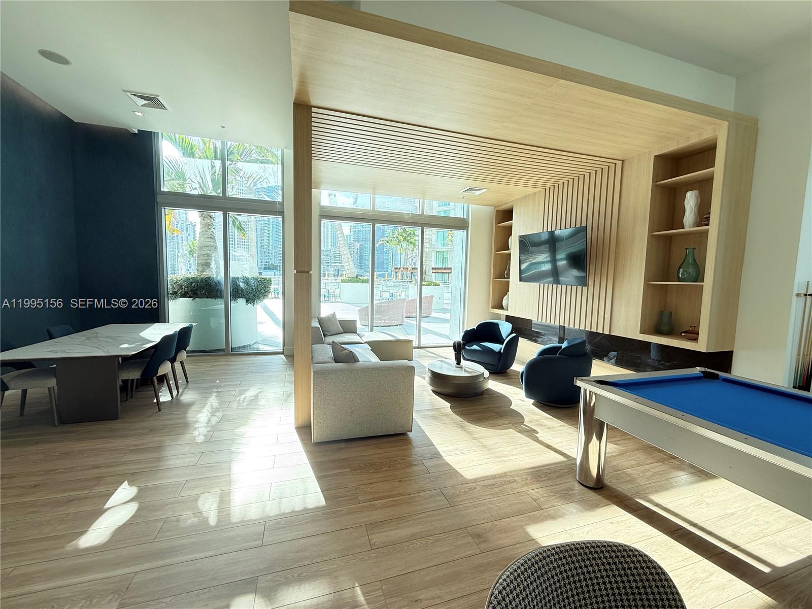 90 Southwest 3rd Street, Unit 2112 Miami, FL 33130 - Photo 35 of 40 a living room with furniture and a table