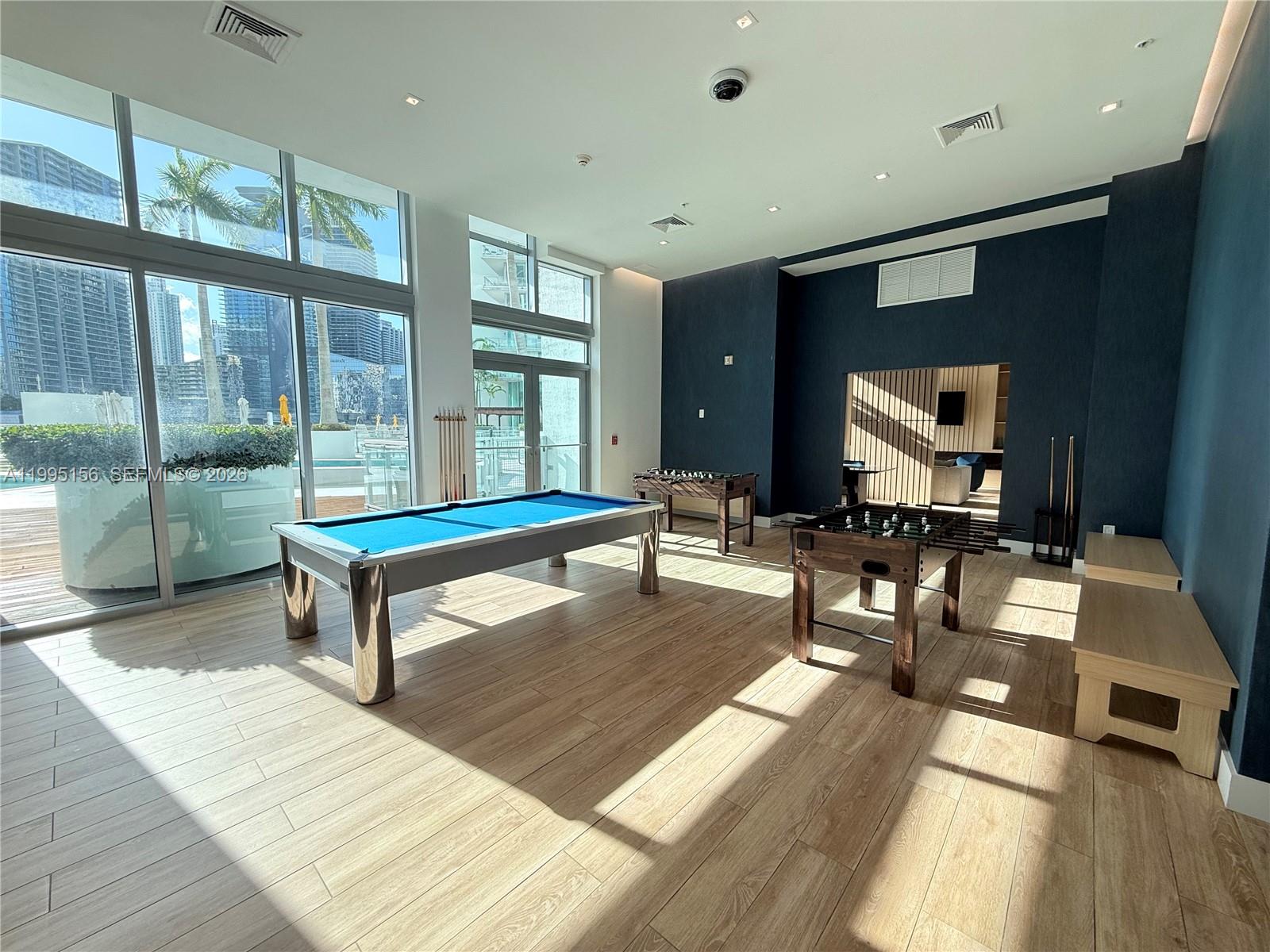 90 Southwest 3rd Street, Unit 2112 Miami, FL 33130 - Photo 36 of 40 a living room with furniture a rug and a flat screen tv