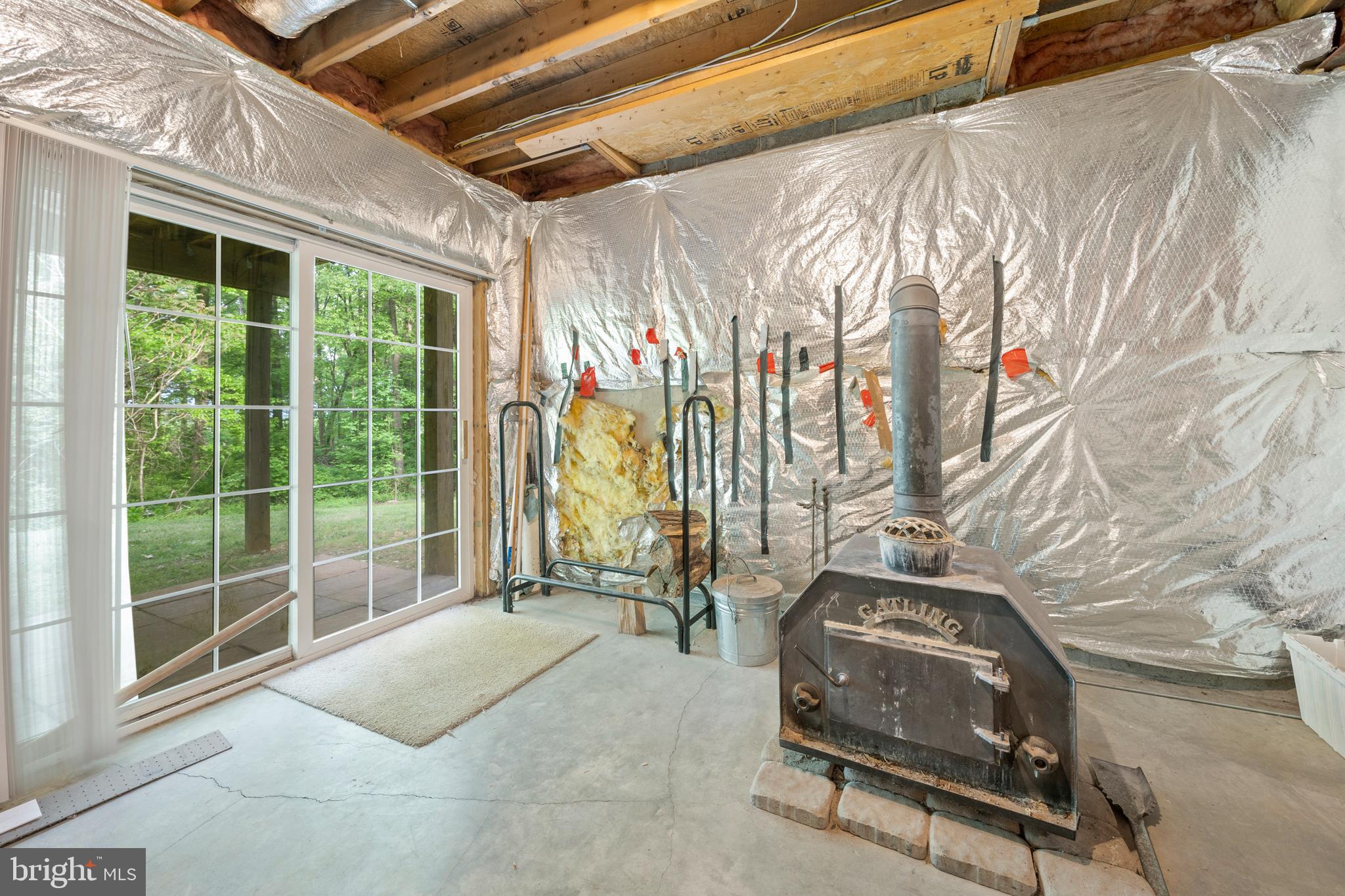 9140 Mudd Road Bel Alton, MD 20611 - Photo 44 of 60 Walkout level and wood-burning fireplace