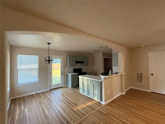 a kitchen with stainless steel appliances granite countertop a sink and a stove top oven