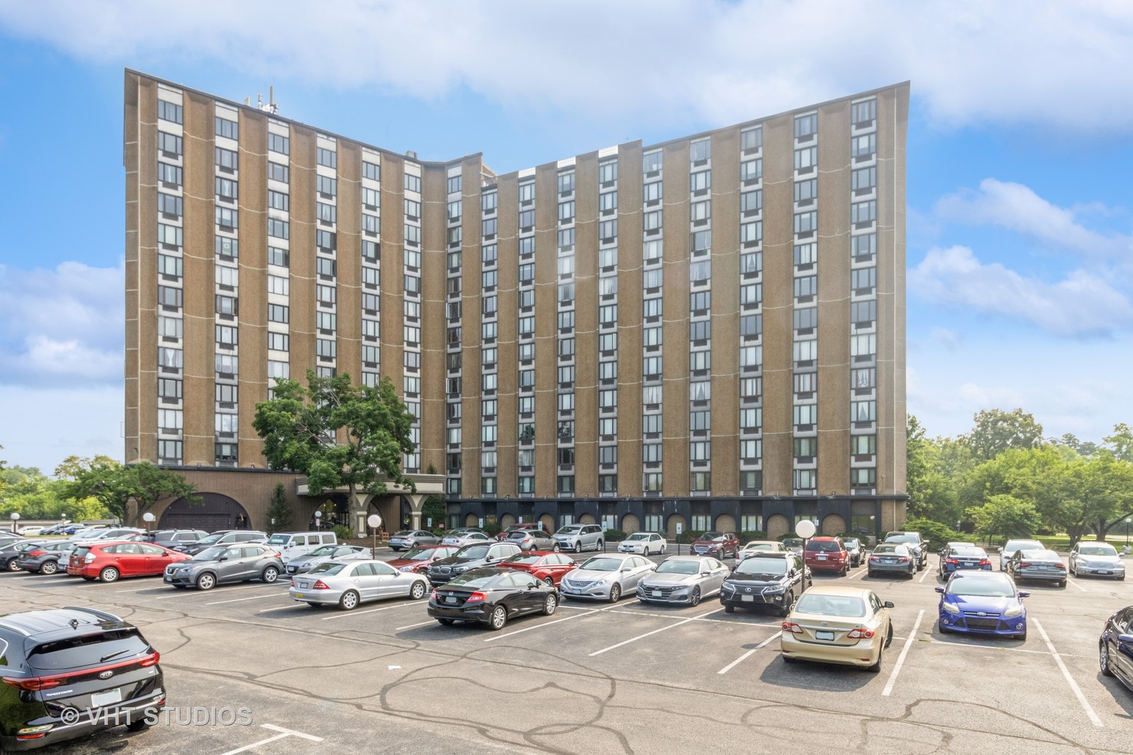 1 Renaissance Place, Unit 217 Palatine, IL 60067 - Photo 1 of 17 a cars parked in front of a tall building