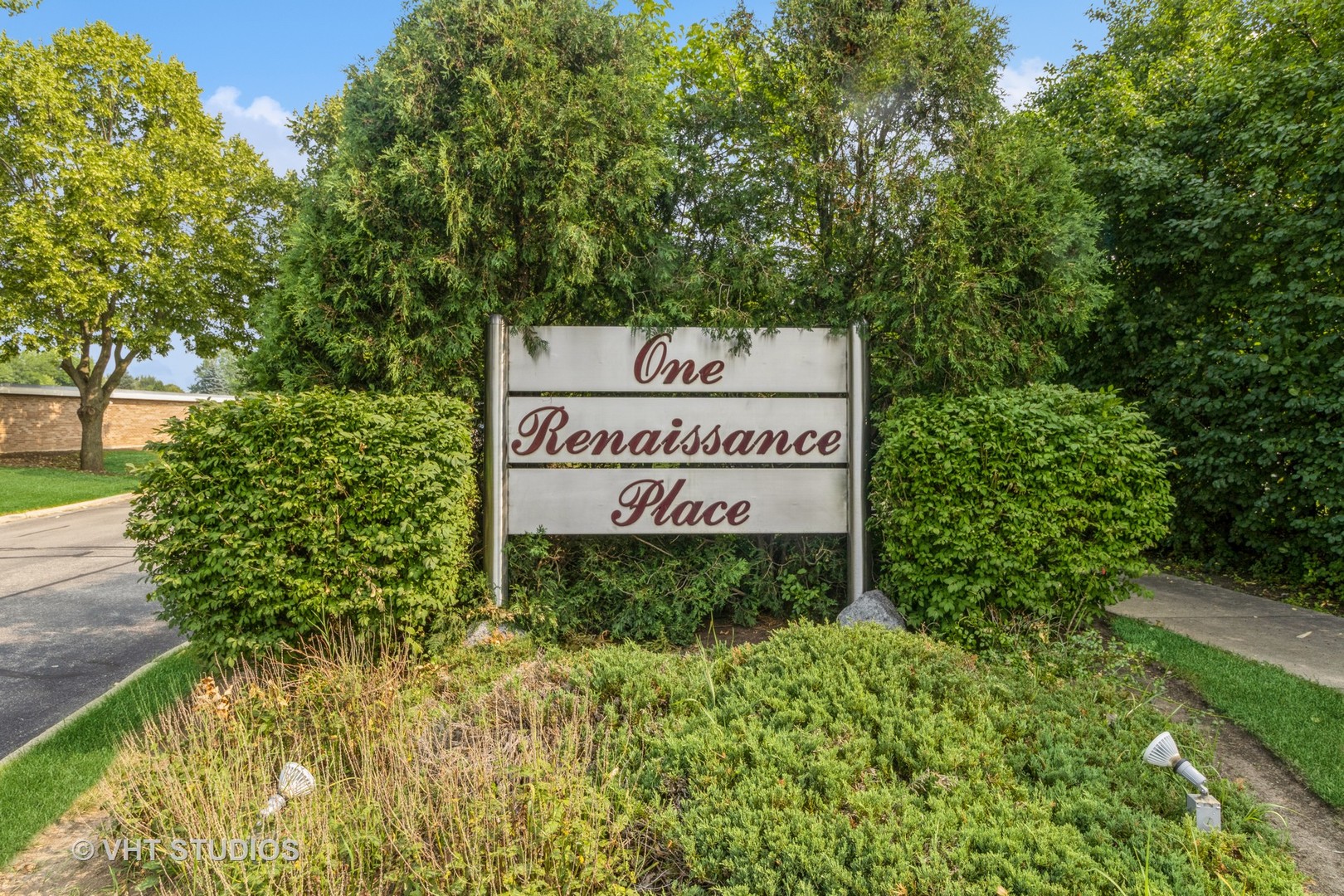 1 Renaissance Place, Unit 217 Palatine, IL 60067 - Photo 14 of 17 a sign of golf club on a wall under a tree